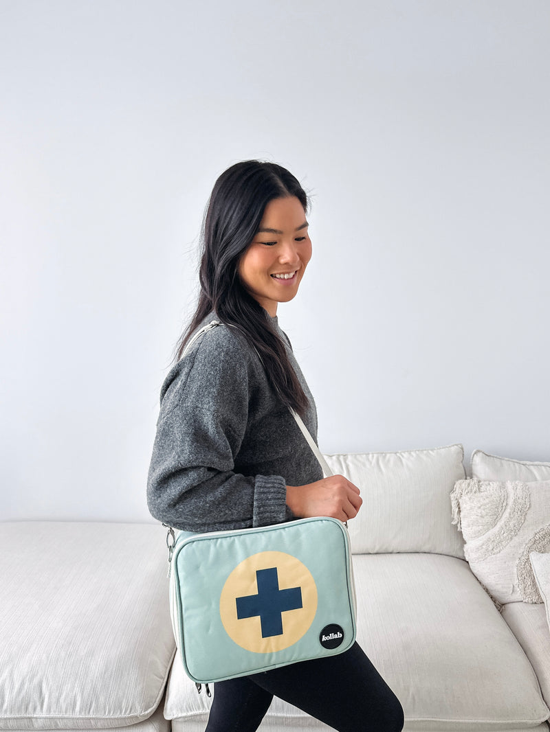 Kollab x RFA first aid kit over shoulder
