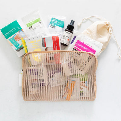 Travel first aid kit coming out of pouch  