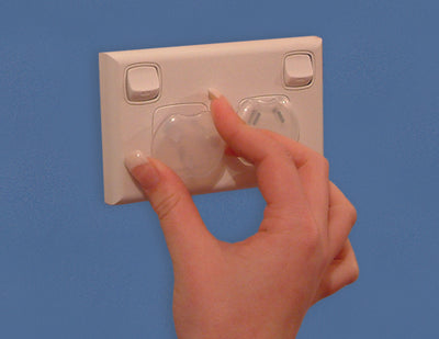 Outlet Plugs 12 pack being placed into plug